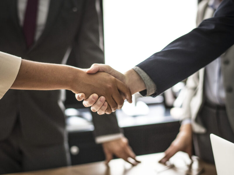 Business people shaking hands in a meeting room